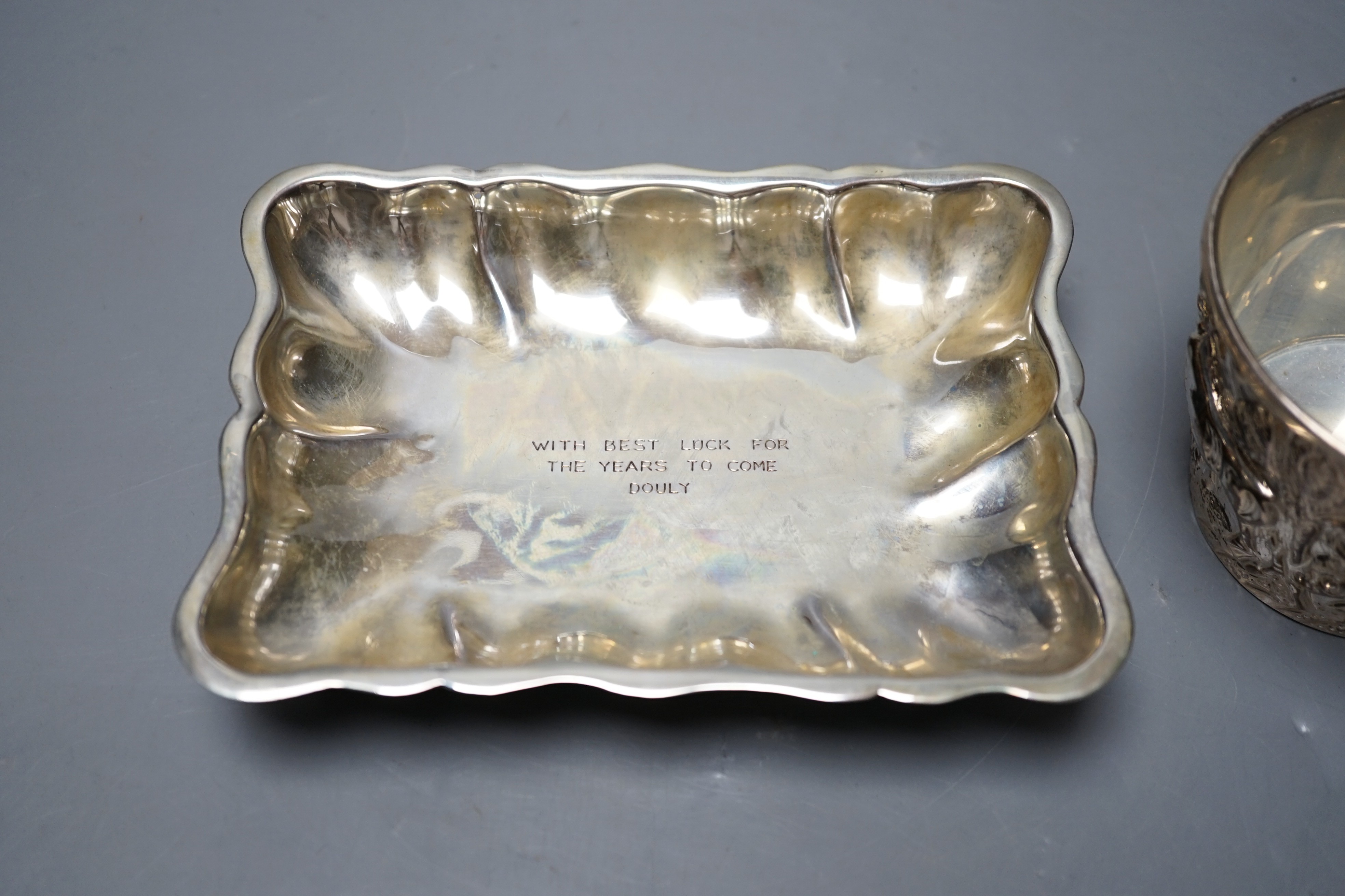 A Greek 900 standard white metal cup, embosses with cattle, height 66mm and a similar dish, gross 10.2oz.